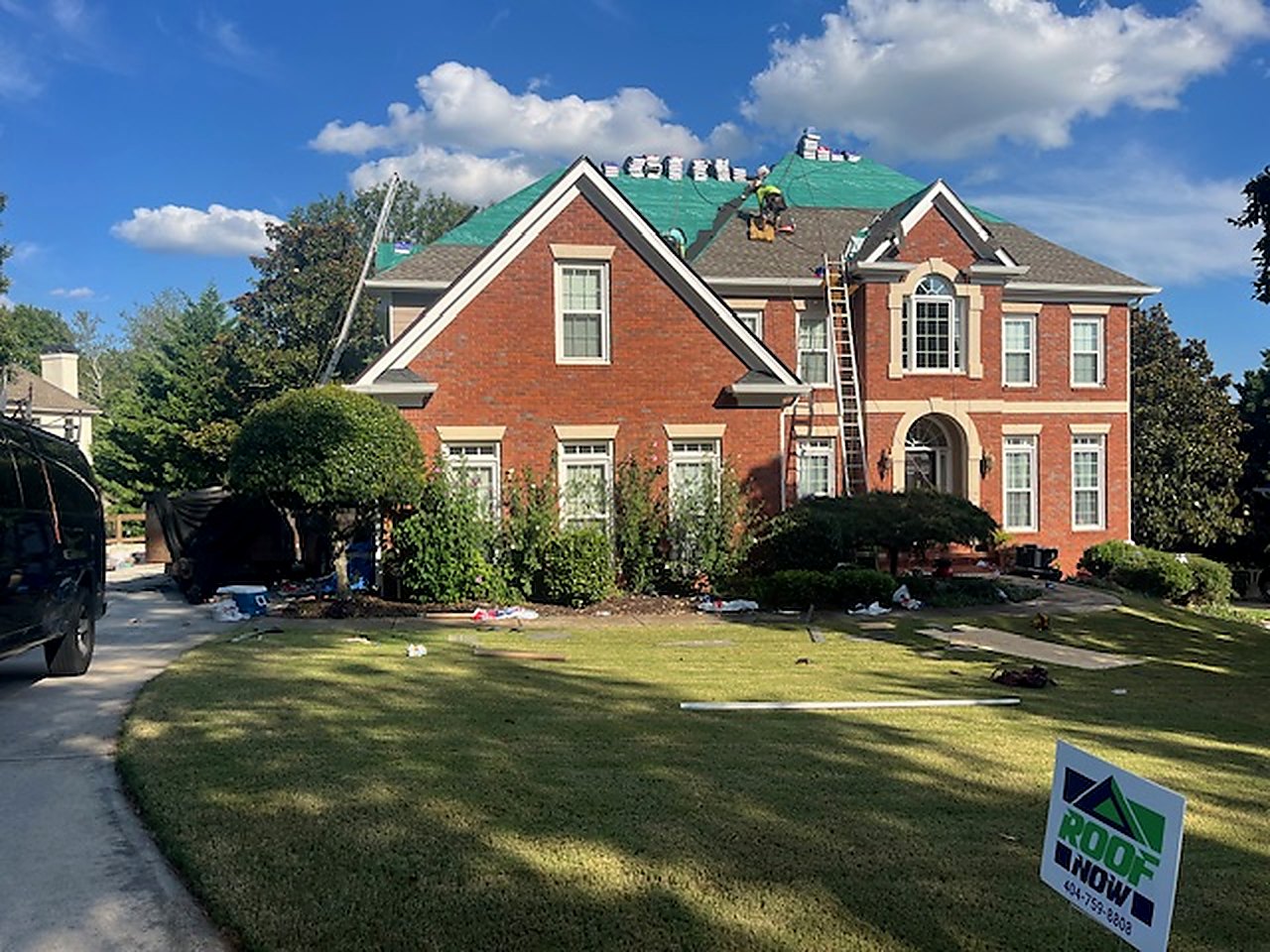 Full tear-off, red-brick two-story