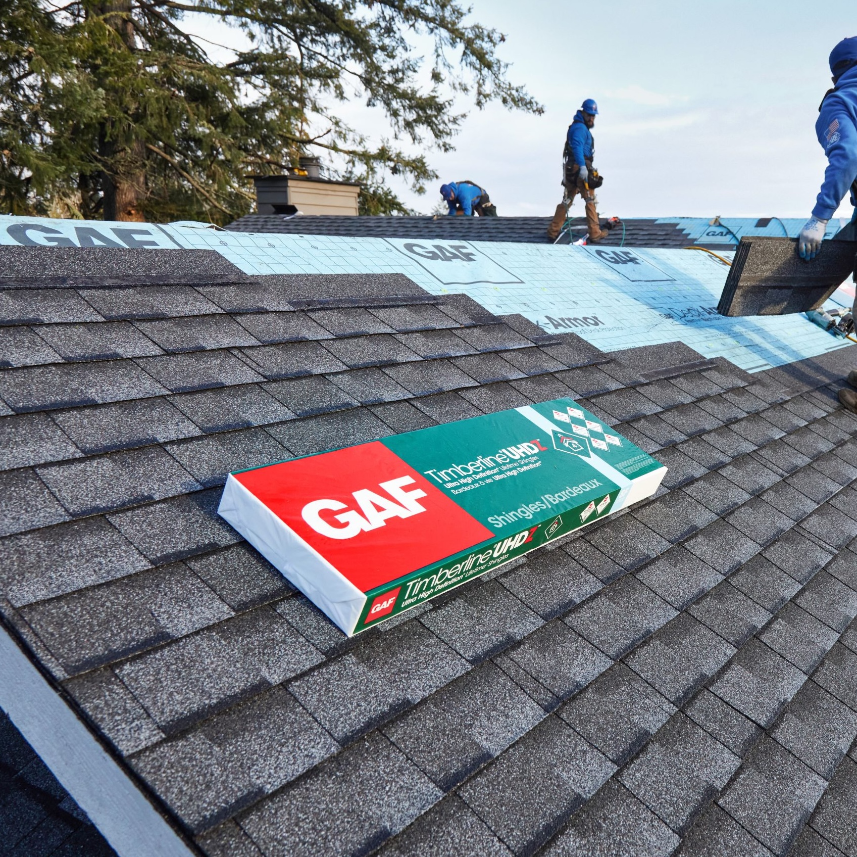 GAF Timberline HDZ shingle bundles staged on a residential roof
